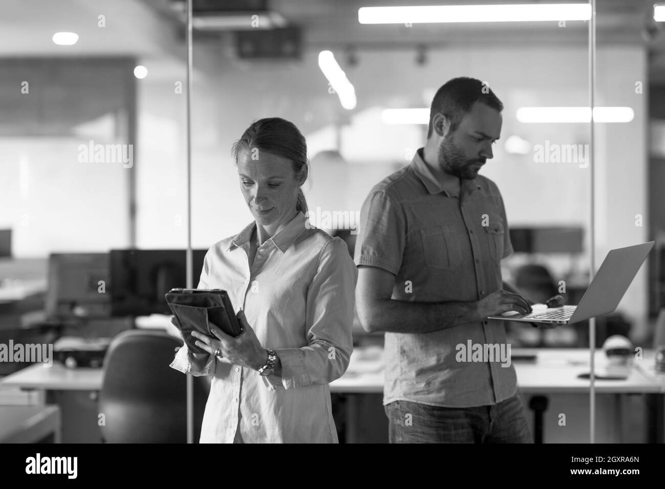 business couple working together on project at modern startup office Stock Photo