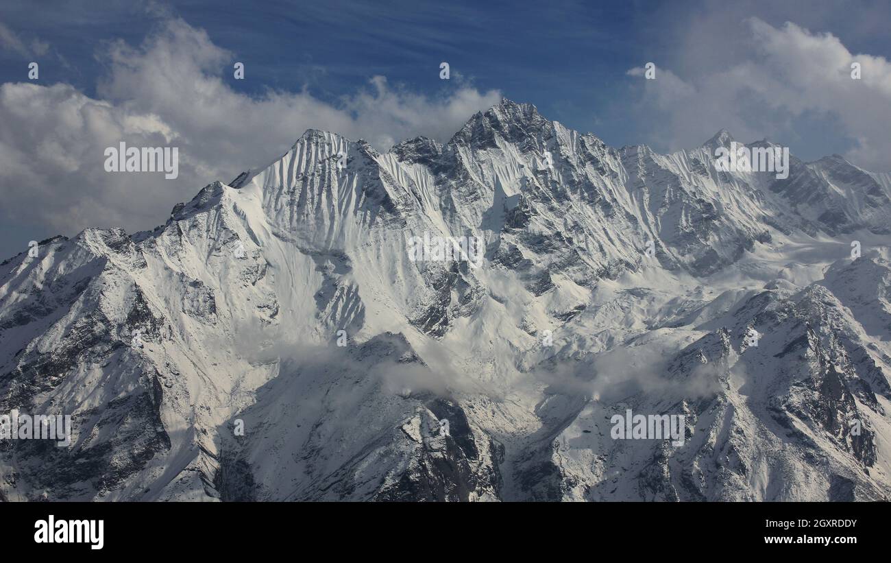 Peak of mount Ponggen Dopchu. View from Tserko Ri, Langtang valley, Nepal. Cloudy spring day. Stock Photo