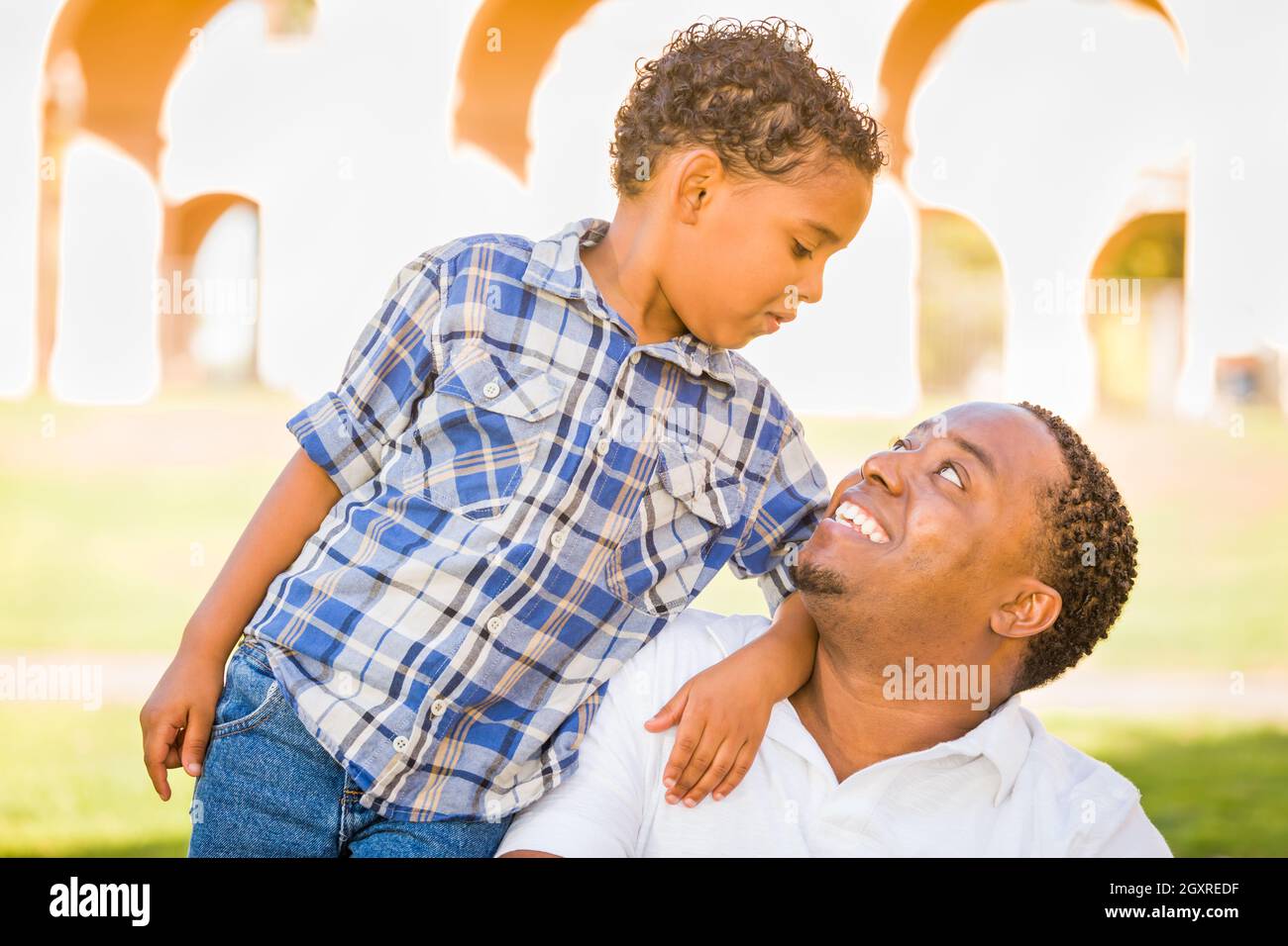 Happy African American Father and Mixed Race Son Playing At The Park ...