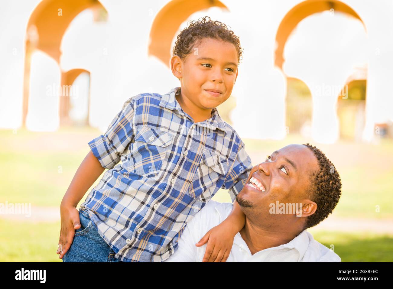 Happy African American Father and Mixed Race Son Playing At The Park ...