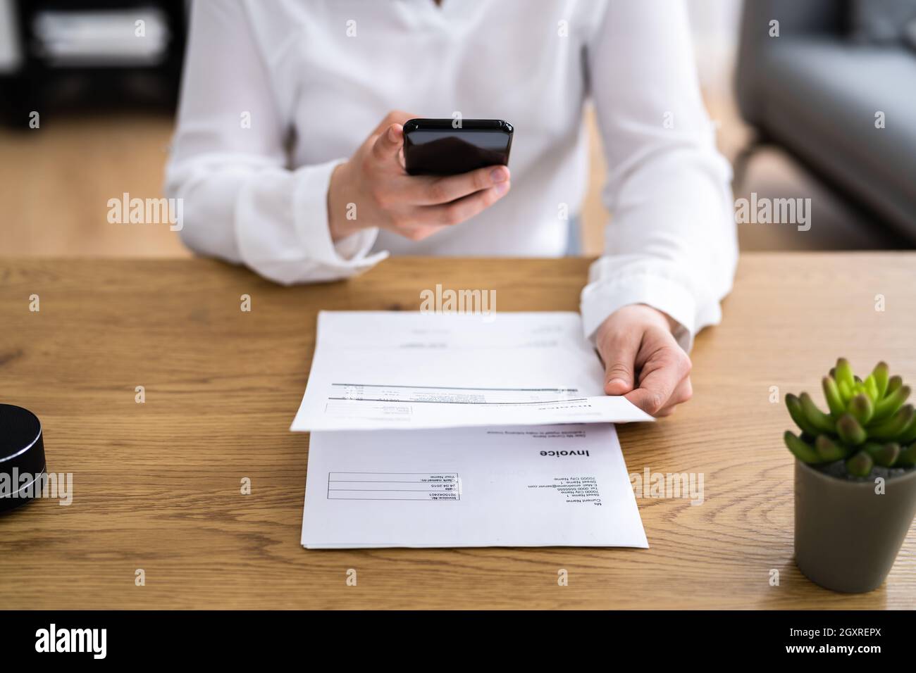 Taking Invoice Document Photo Using Phone Or Smartphone Stock Photo