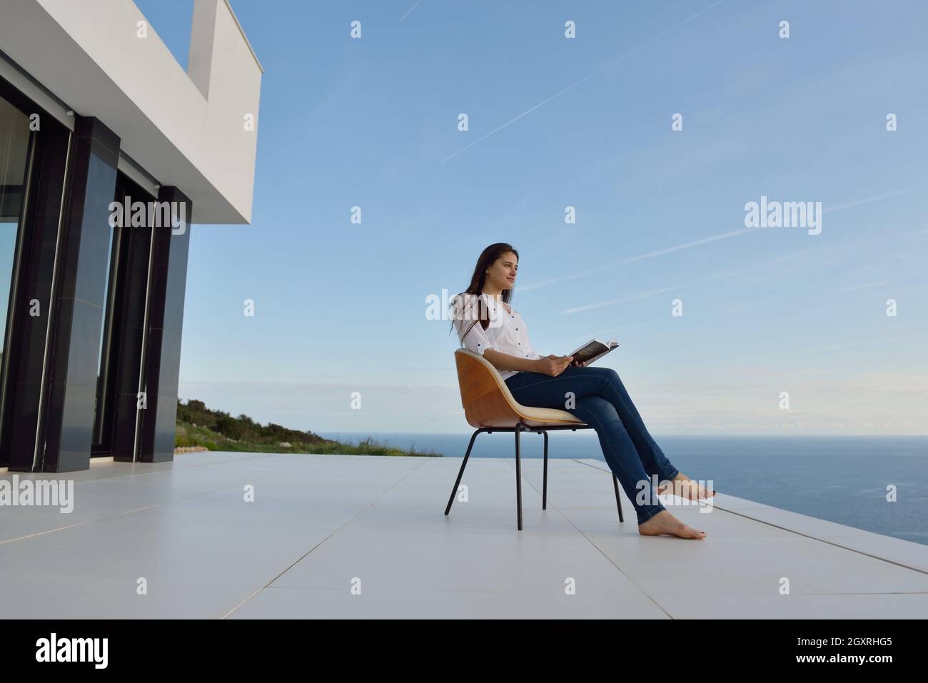 happy young woman relaxing at home Stock Photo - Alamy