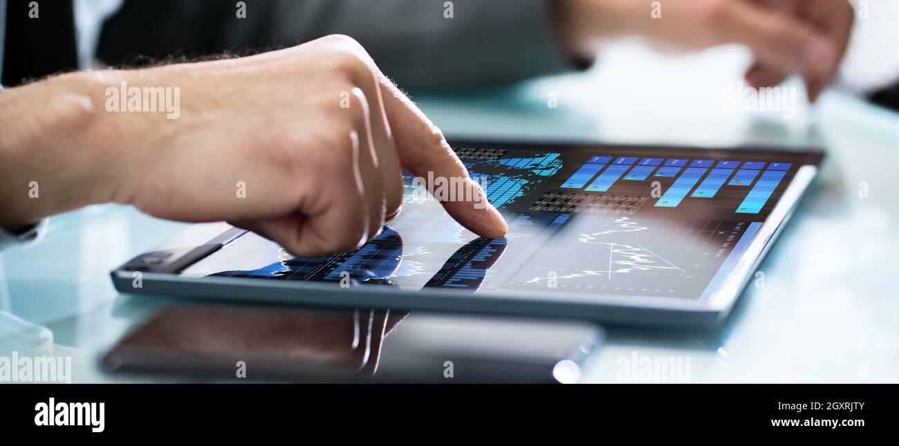 Investor Mobile Dashboard Analytics Data On Tablet Stock Photo