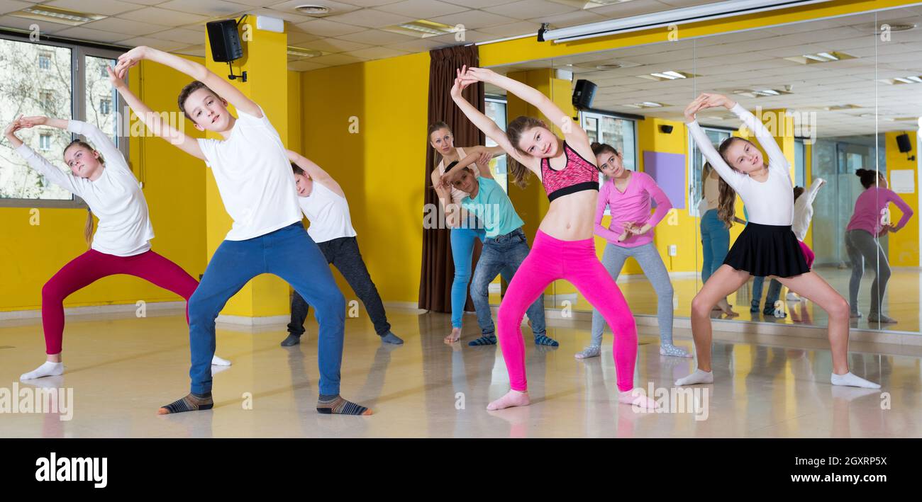 Teenagers practicing dance in studio Stock Photo