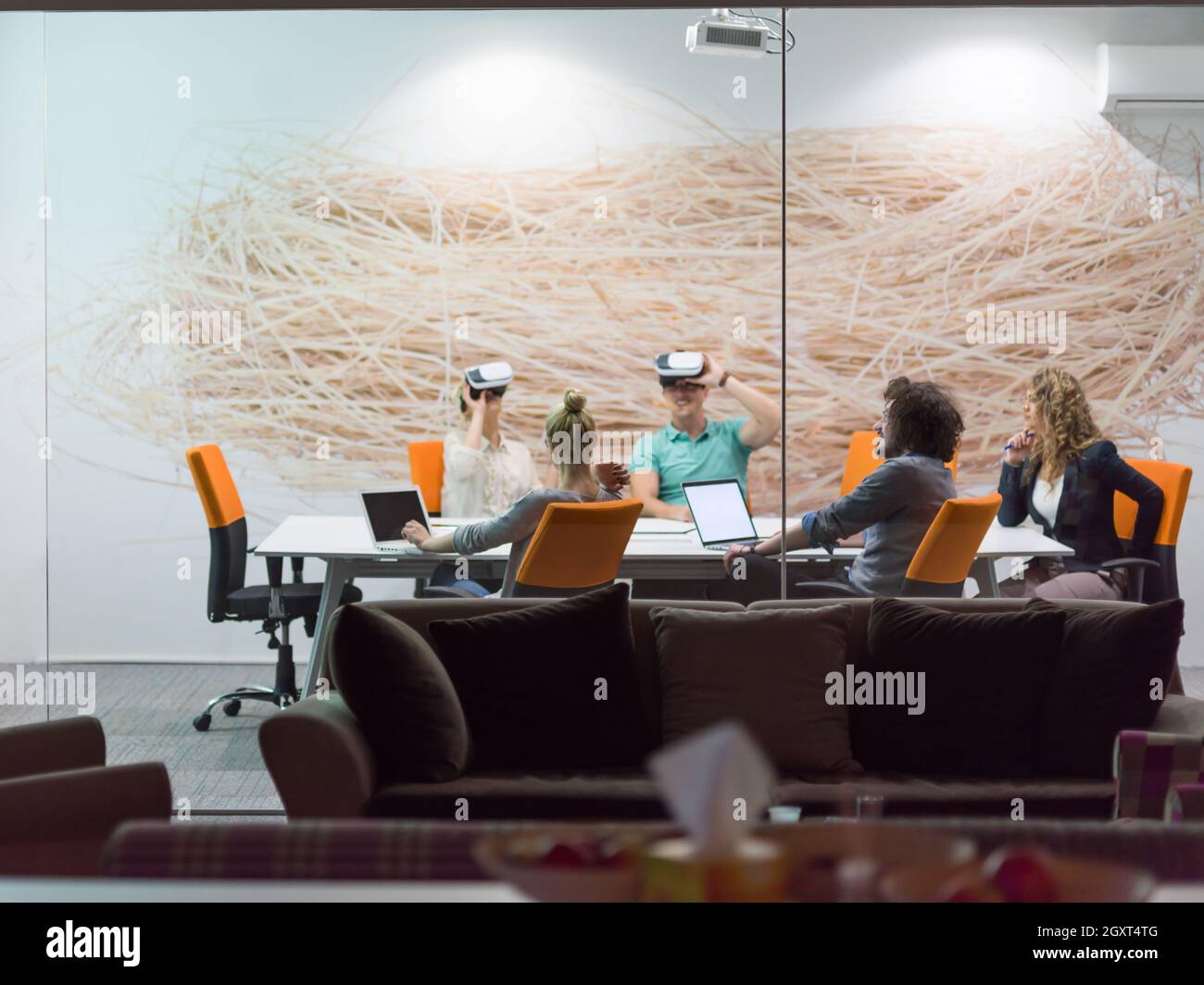 Meeting Simulation startup Business team using virtual reality headset in night office ...