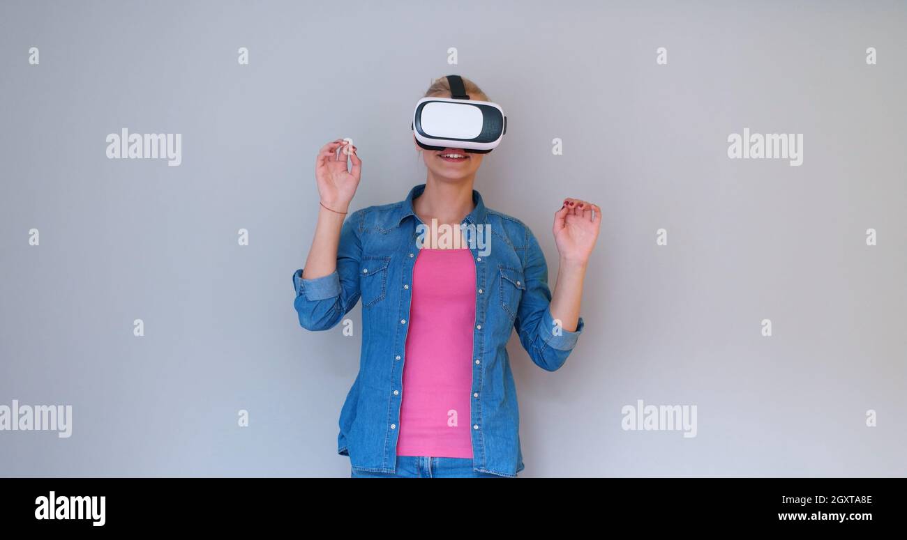 Happy girl getting experience using VR headset glasses of virtual ...
