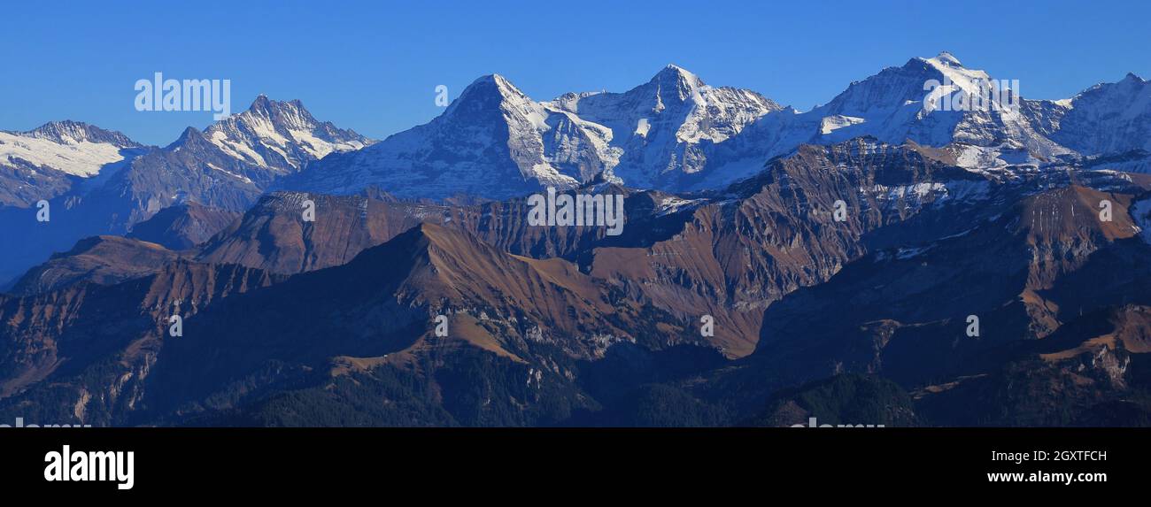 Famous mountain range Eiger, Monch and Jungfrau on a clear autumn day ...