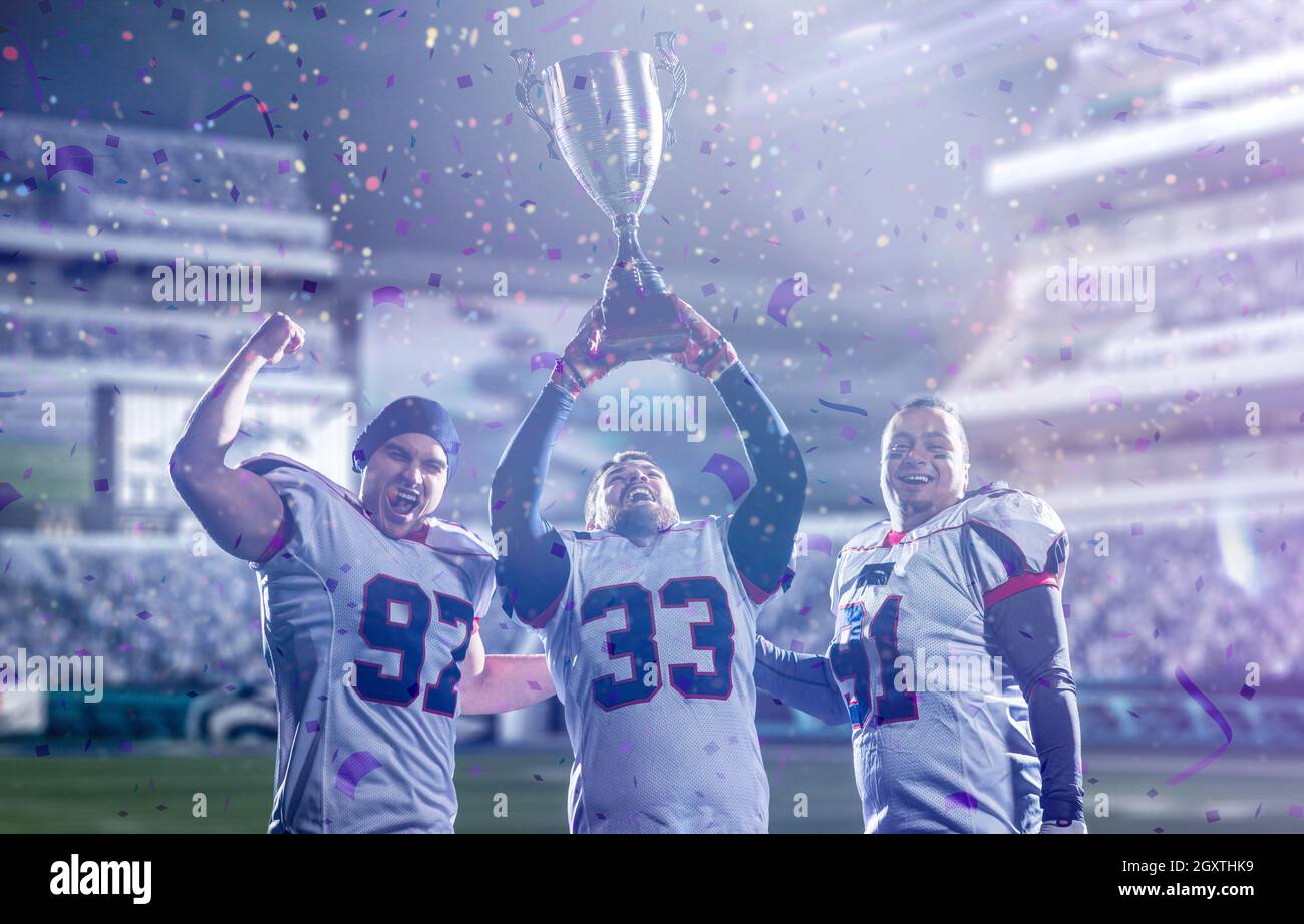 happy american football team with trophy celebrating victory in the cup ...