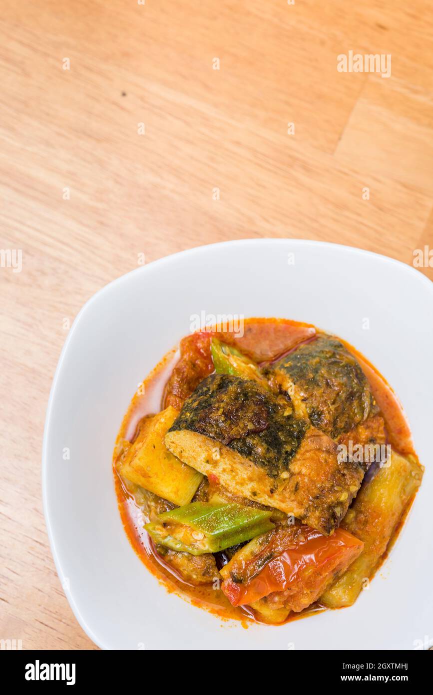 Vegetarian curry fish and vegetables in white bowl. Stock Photo