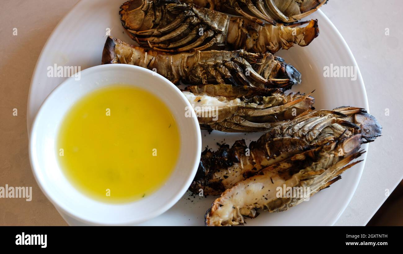 Seafood Grilled Lobsters Marine Crustaceans with Garlic Butter Sauce Stock Photo