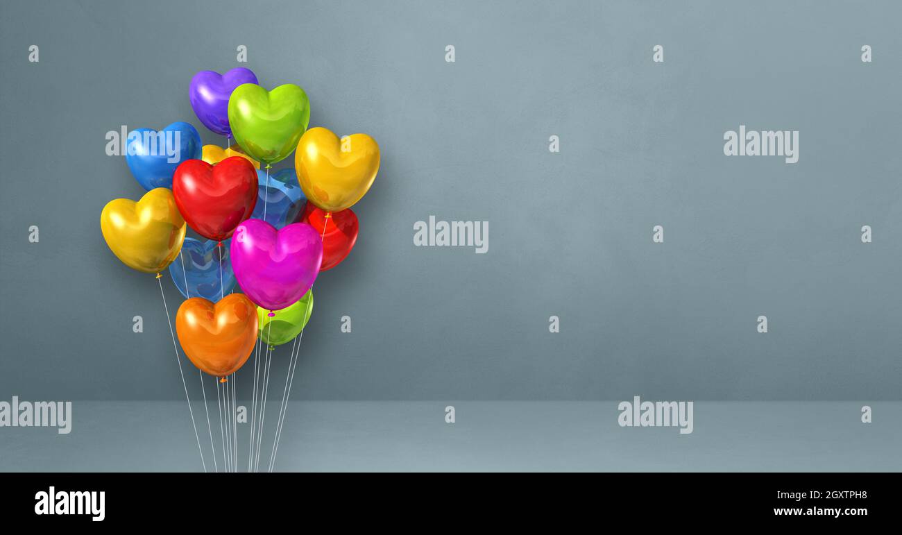 Colorful heart shape balloons bunch on a grey wall background ...