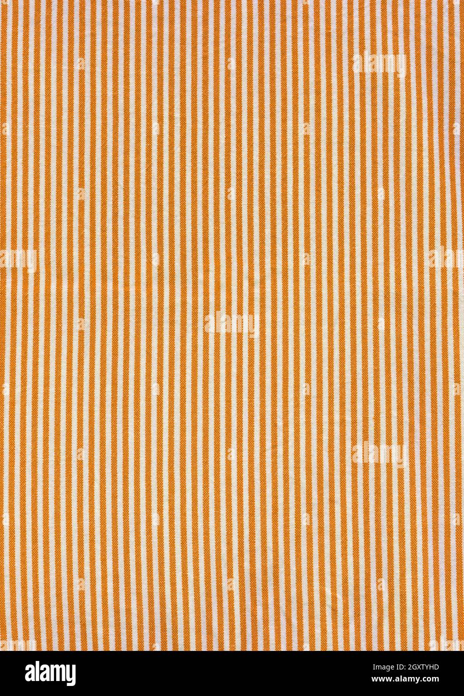 Orange striped tablecloth background texture. Fabric wallpaper Stock Photo
