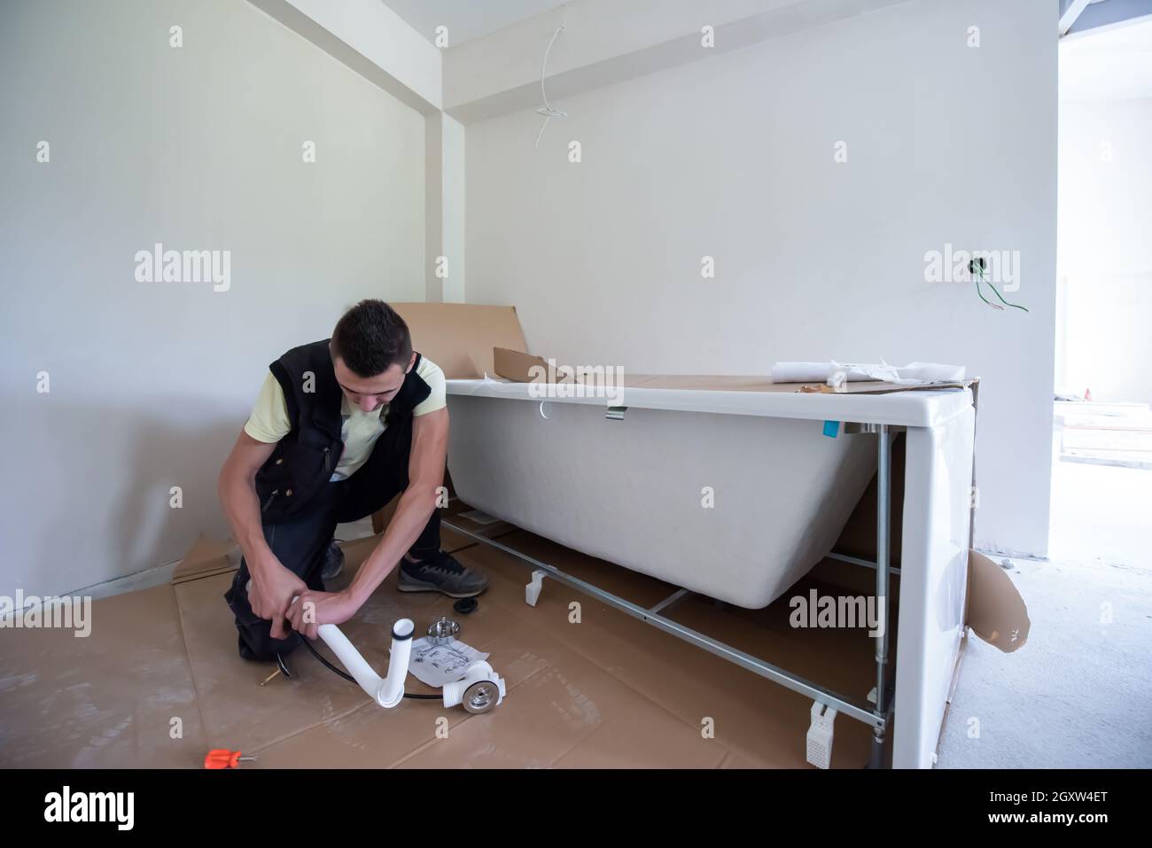 Picture of professional plumber working in a bathroom, plumbing repair service ...