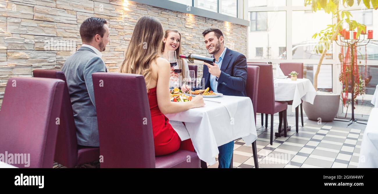 People in a fancy Restaurant eating and having a good time Stock Photo