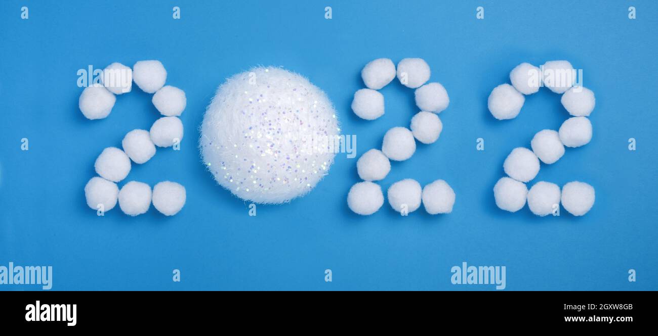 Snow White Christmas 2022 Happy New Year 2022 Celebration. Snow-White Christmas Balls, Snow,, 2022  Creative Number On A Light Blue Background. Flat Lay. Banner Stock Photo -  Alamy