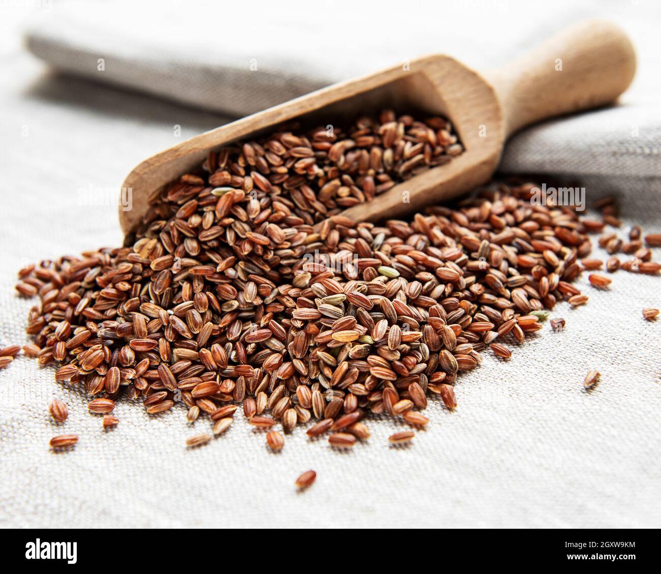 Old Red Rice Raw red rice on a old textile background Stock Photo - Alamy