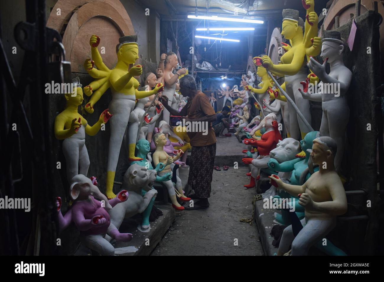 Kolkata, India. 05th Oct, 2021. Artists are seen coloring Durga idols.  Durga puja is one of the most popular festivals celebrated in West Bengal  and particularly in Kolkata, In honor of Goddess