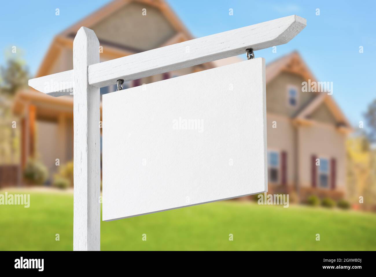 Blank Real Estate Sign in Front of Beautiful New House Stock Photo - Alamy