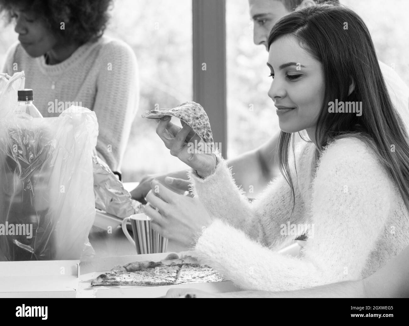 Young girl eating delicious pizza Stock Photo