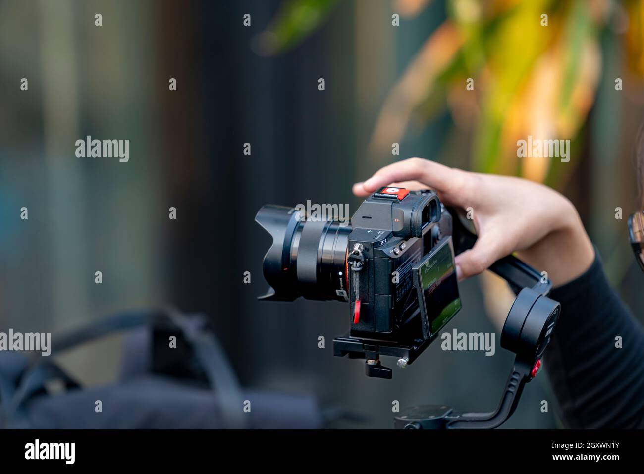 Bangkok,Thailand 2 February 2020: Videoman holding FILMING WITH DJI RONIN M handheld AND SONY A7R mark III. Full-Frame Exmor R BSI CMOS Sensor. Alpha Stock Photo