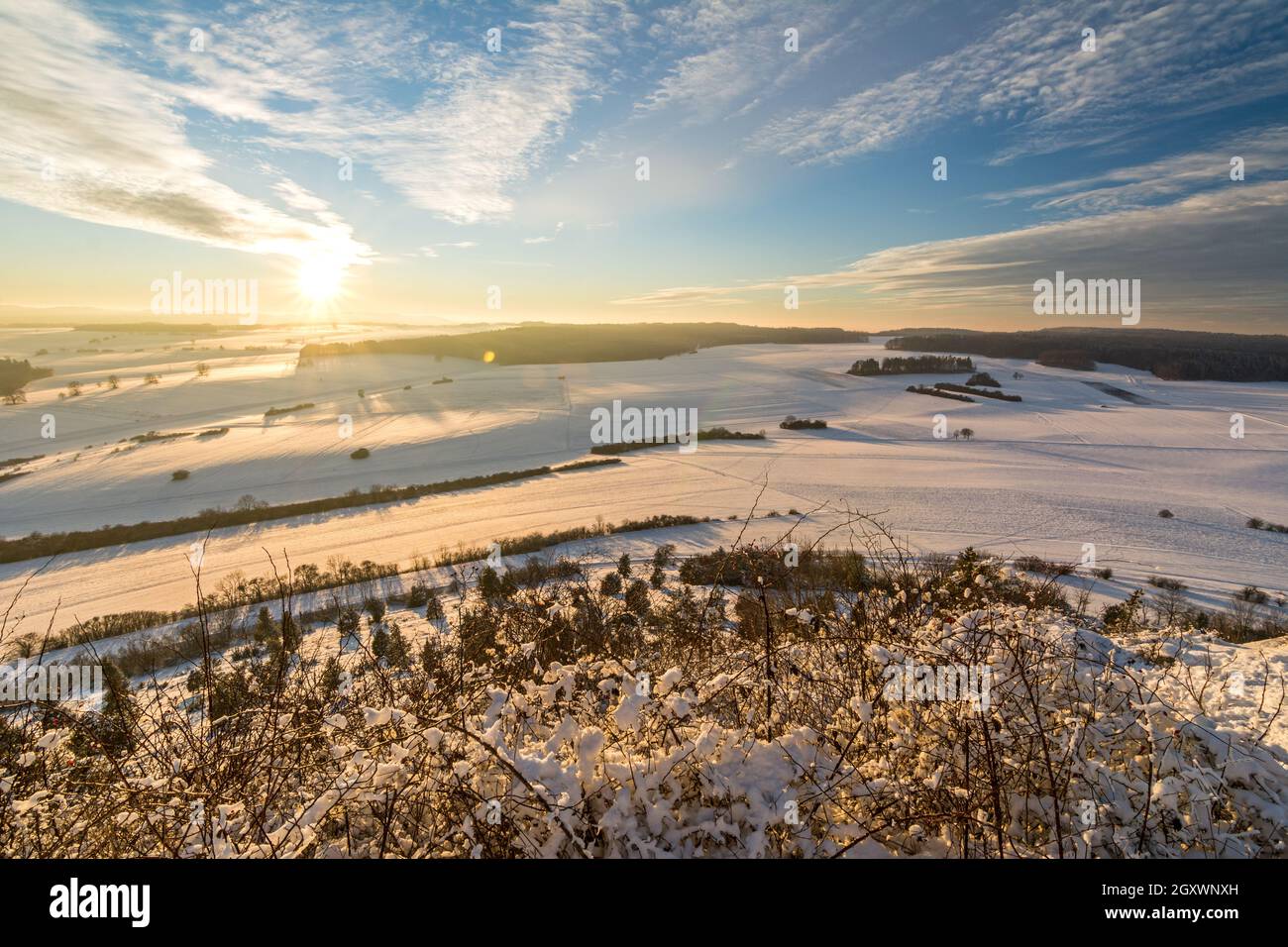 Panorama view of beautiful snowy winter landscape in the Swabian Alps at sunset Stock Photo