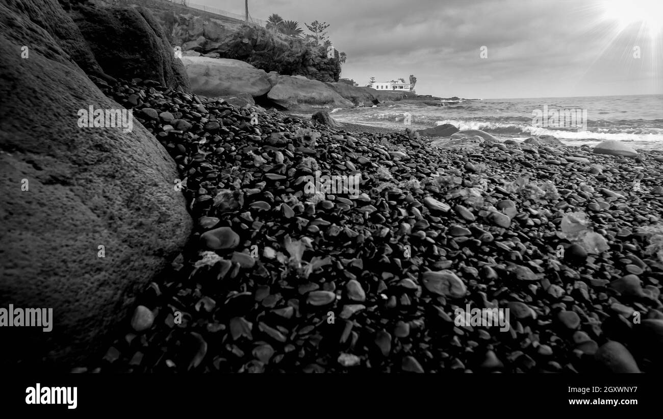 Black and white image of beautiful ocean coast with rocky beach Stock ...