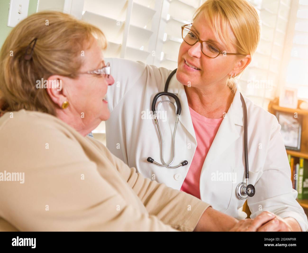 Woman in 40s talking to doctor hi-res stock photography and images - Alamy