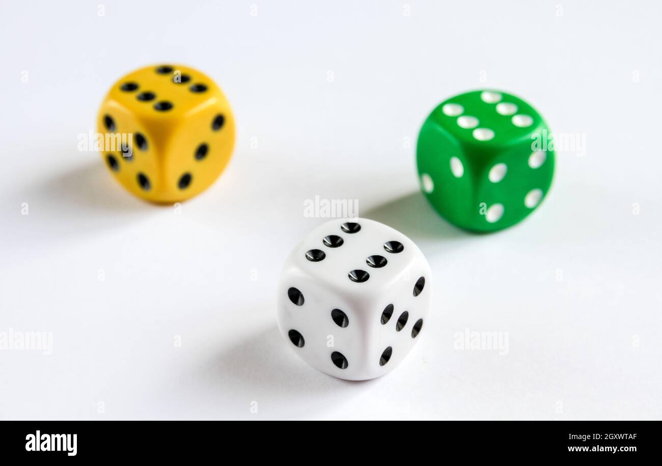 Three colorful dices isolated on white background. Top view Stock Photo
