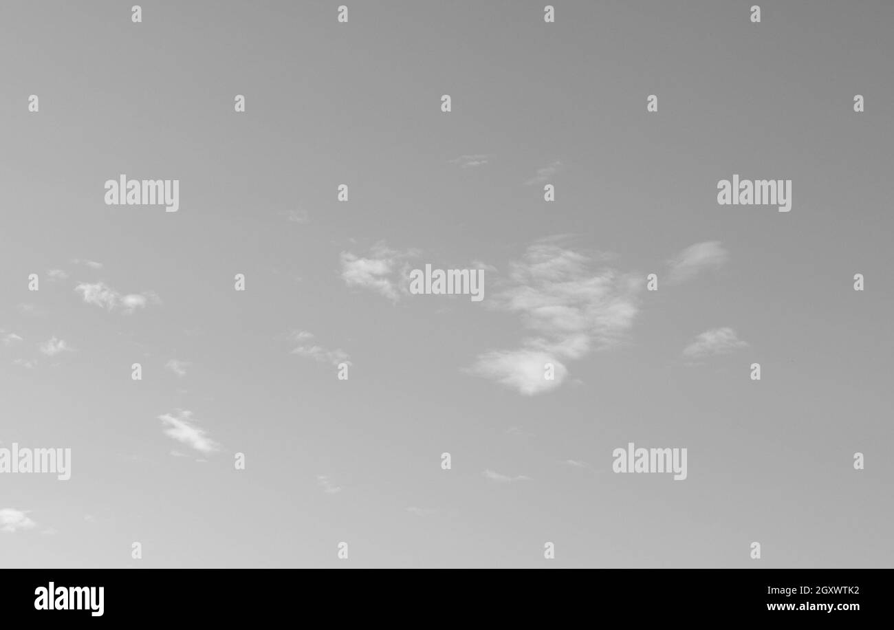 sky with a few clouds useful as a background in black and white Stock ...