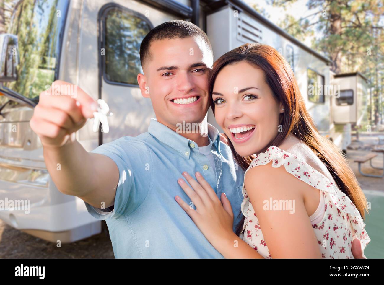 Young Military Couple Holding Keys In Front of New RV Stock Photo - Alamy