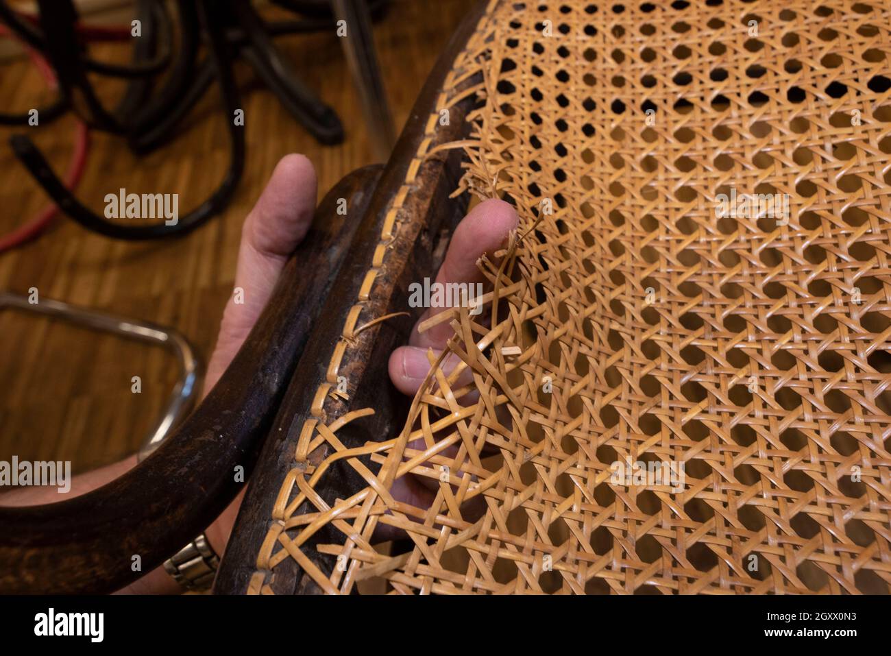 basket weaving in a sheltered workshop, work with disabled or handicapped people Stock Photo