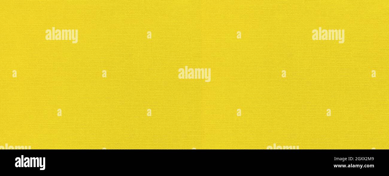 Yellow canvas texture background banner. Clean fabric wallpaper Stock