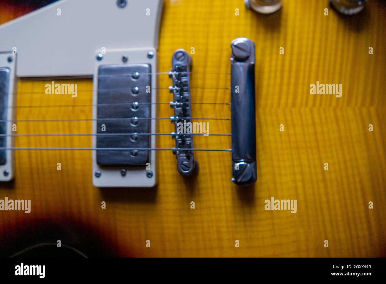 Strings and pickups of classic yellow electric guitar Stock Photo