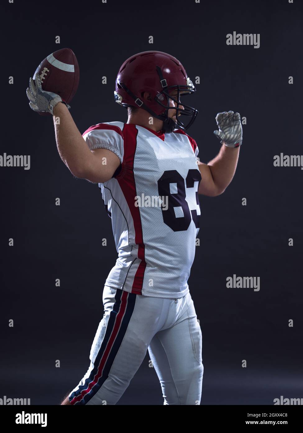 one quarterback american football player throwing ball isolated on gray