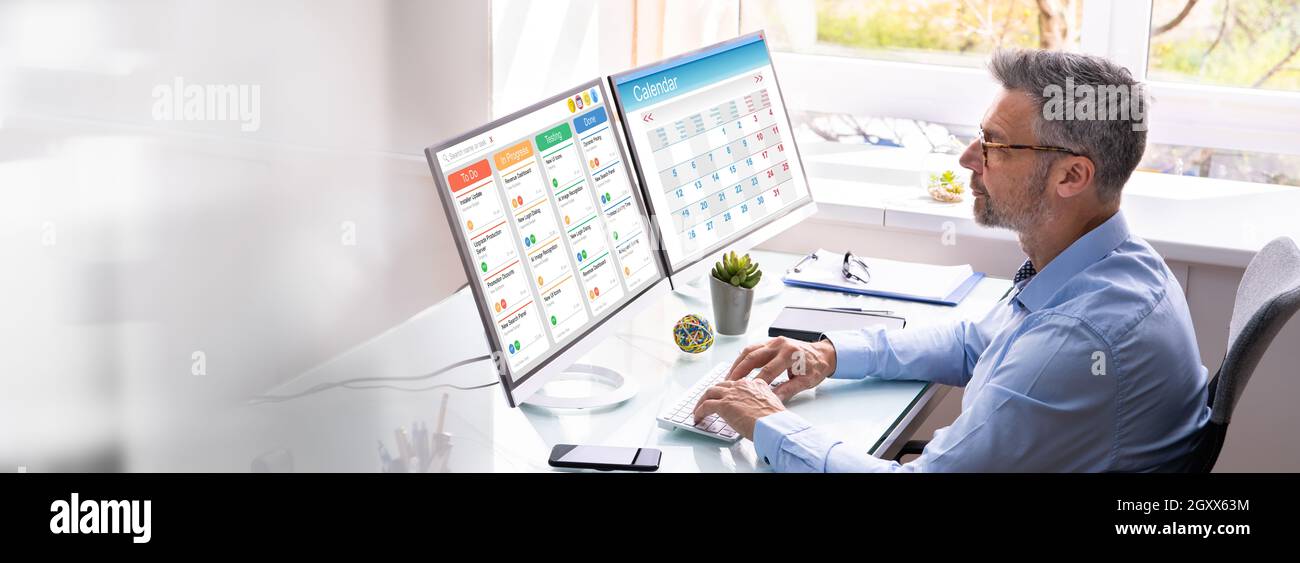 Gantt Tasks Schedule Chart On Computer In Office Stock Photo