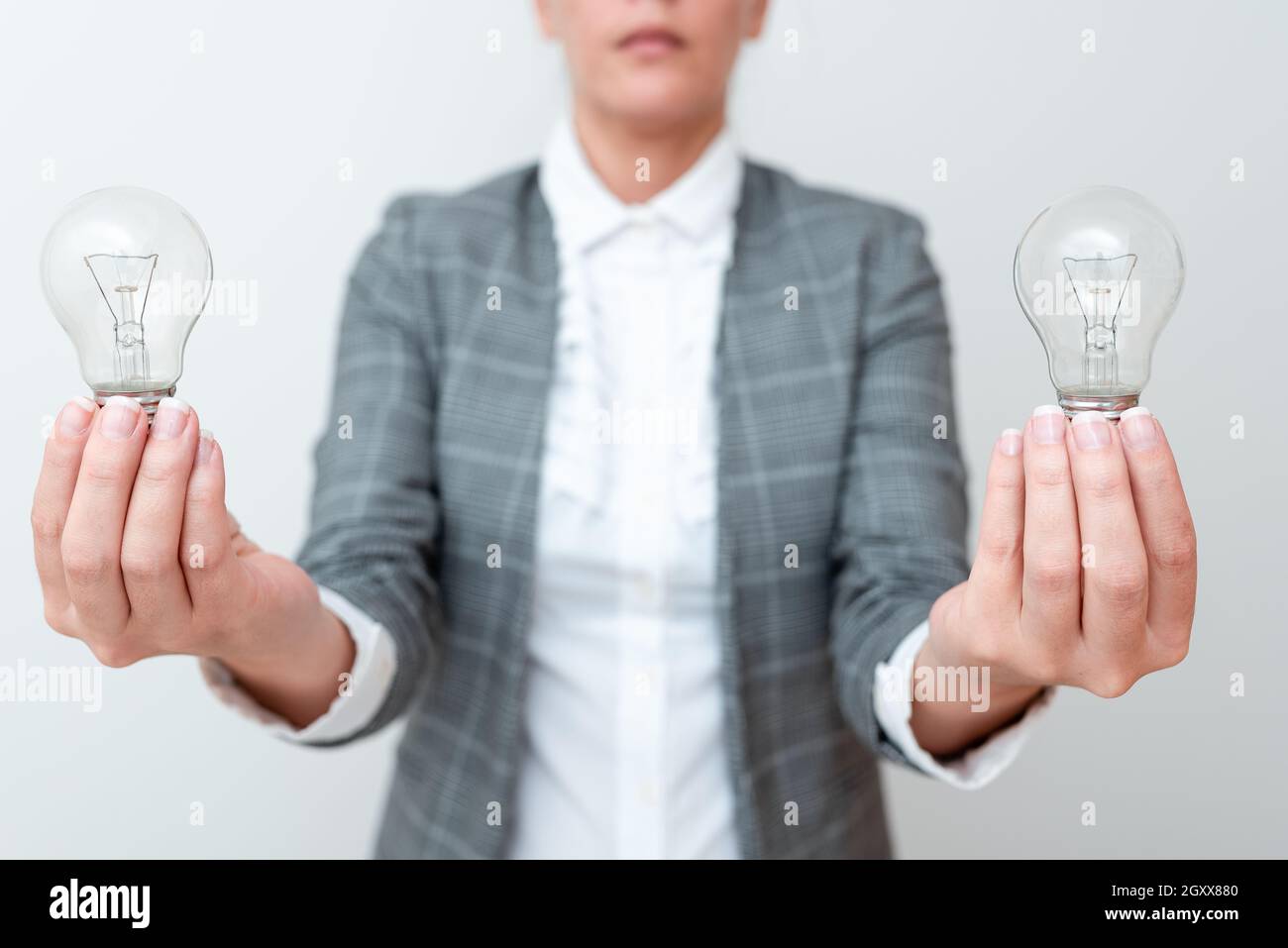 Lady Carrying Two Lightbulbs In Hands With Formal Outfit Presenting Another Ideas For Project