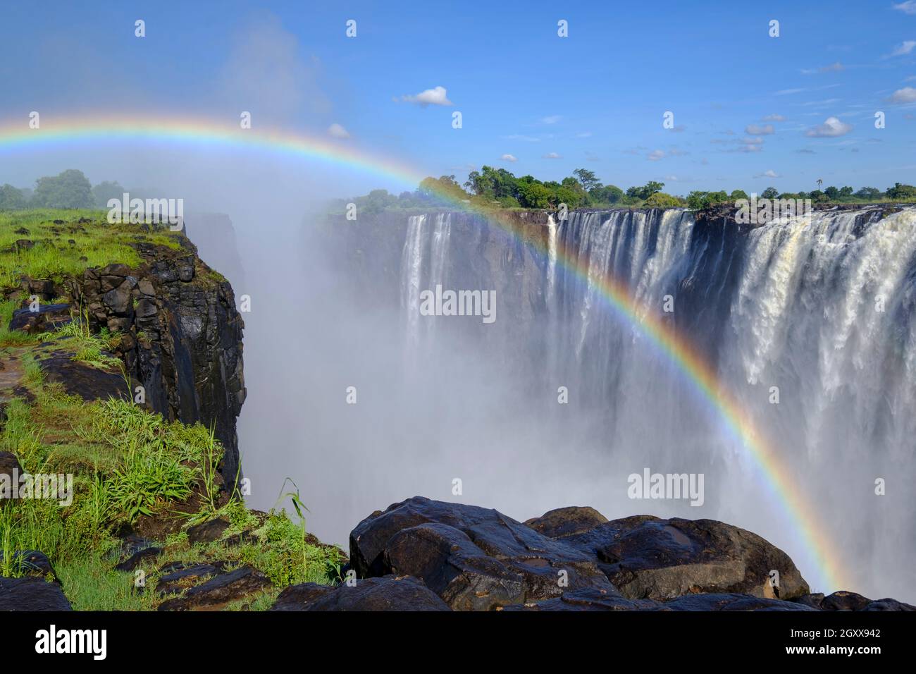 Victoria Falls with rainbow. Victoria Falls National Park, Zimbabwe, Africa Stock Photo