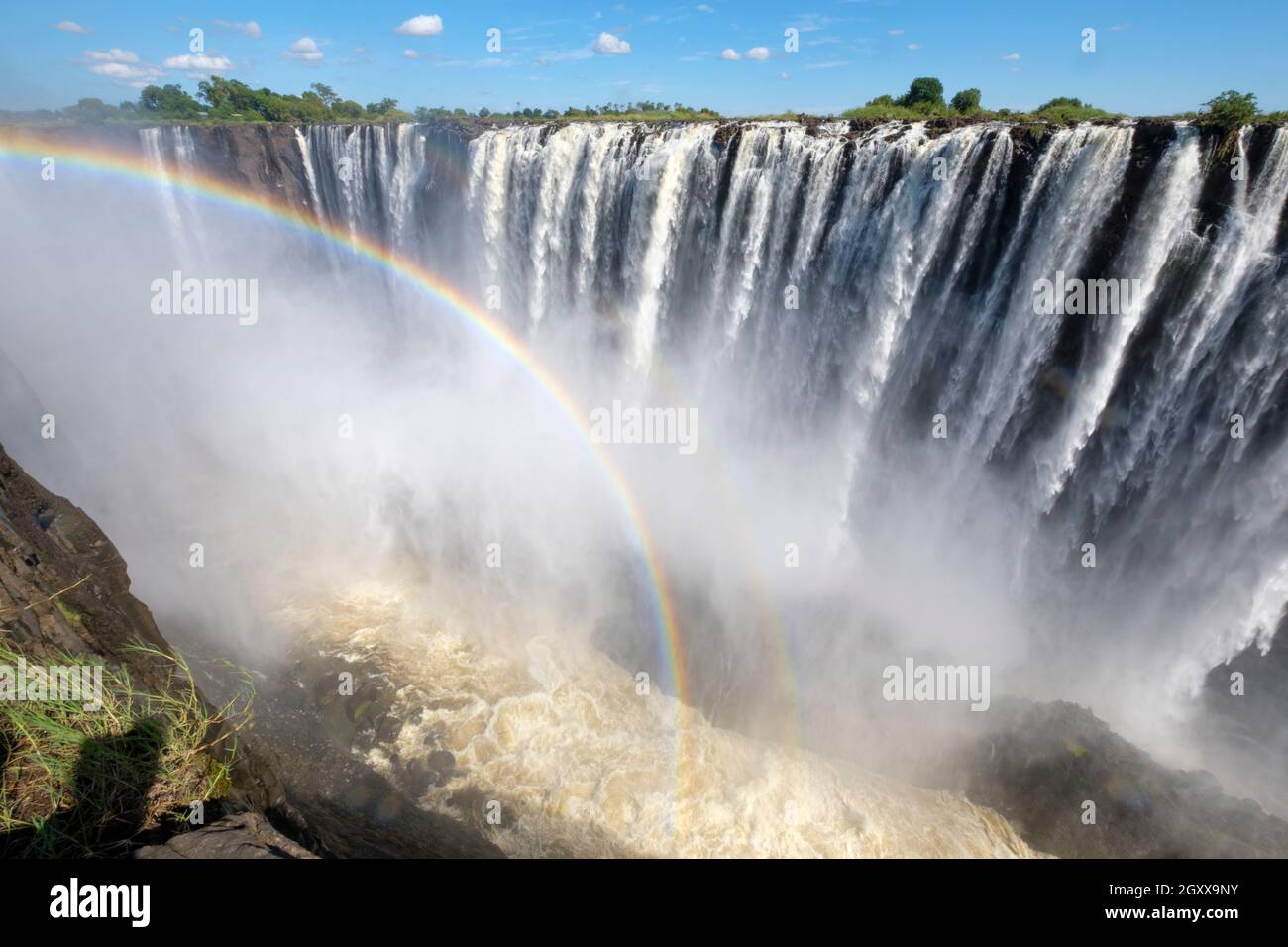 Victoria Falls with rainbow. Victoria Falls National Park, Zimbabwe, Africa Stock Photo