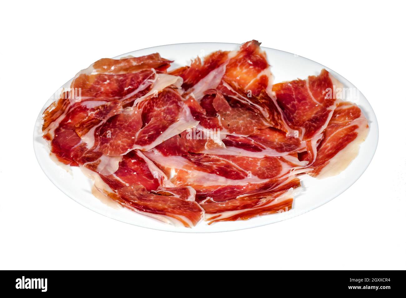 Serrano ham, ham, typical and delicious Spanish food, isolated background on white. Selective focus foreground Stock Photo