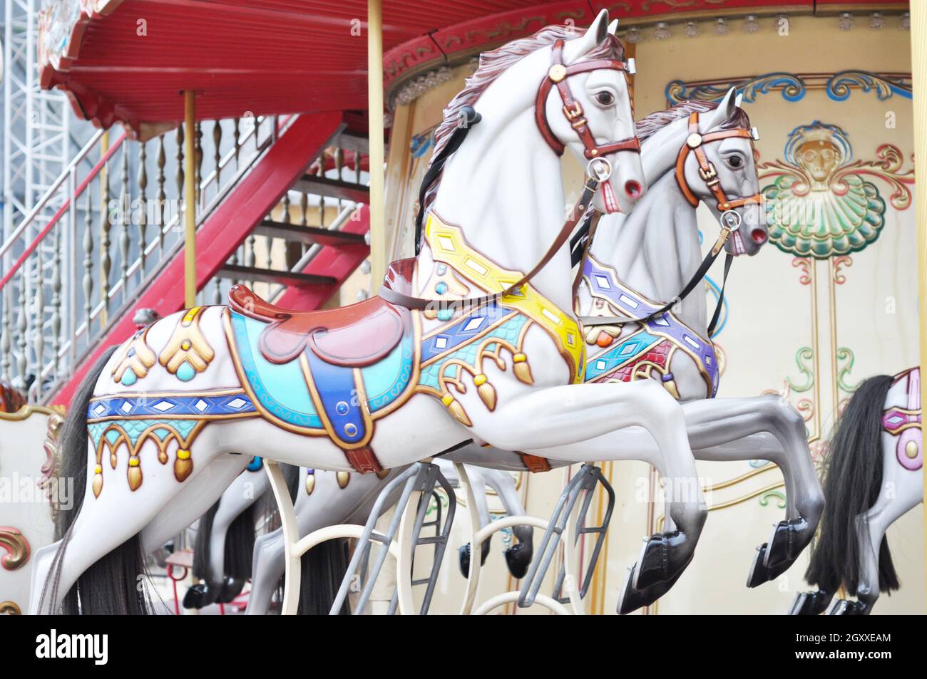 Horses carousel attraction. Festival holiday Stock Photo - Alamy