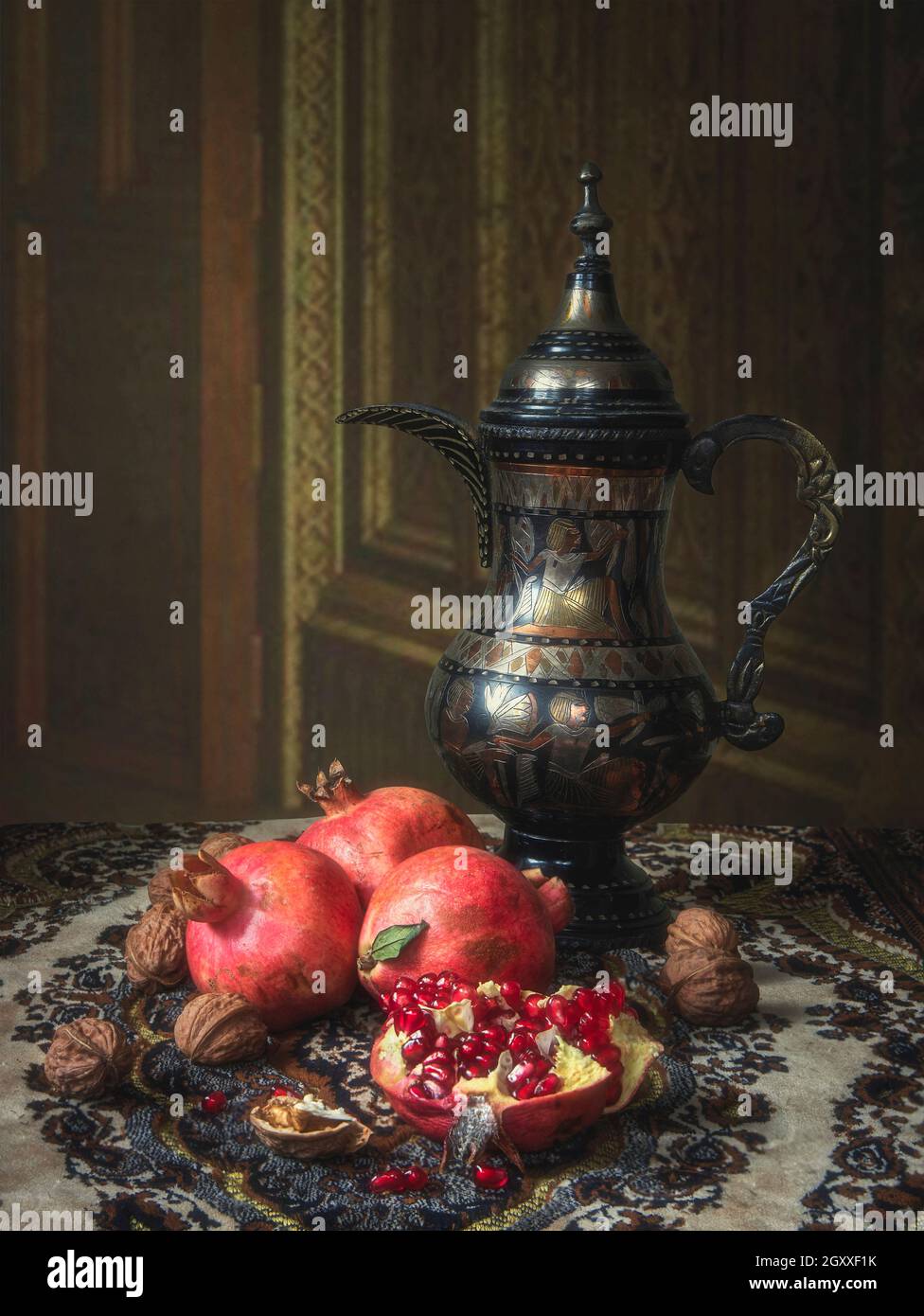 Still life with  pomegranate and walnuts Stock Photo