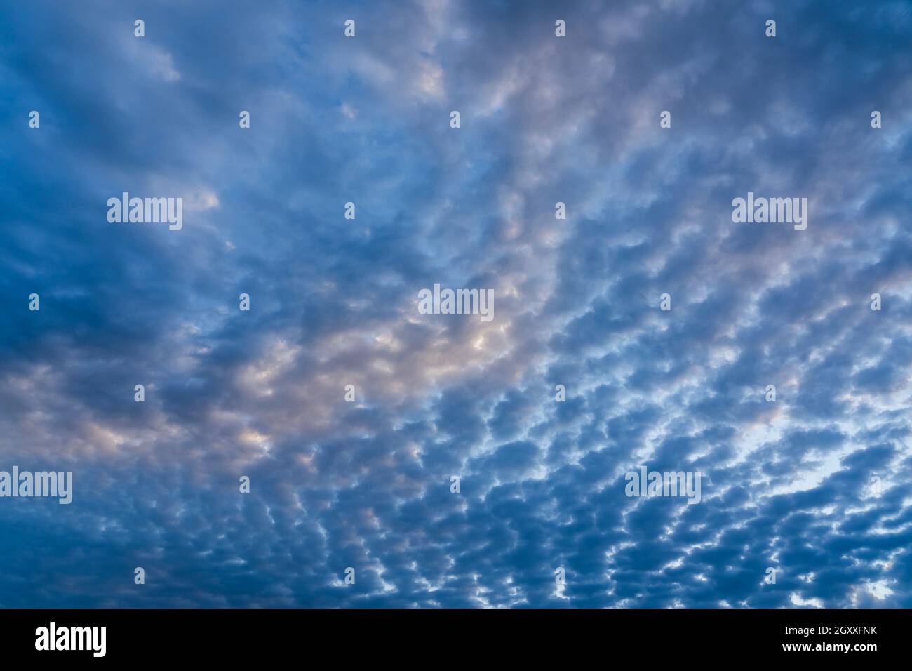 Beautiful clouds of different shapes in the sky before sunset Stock ...