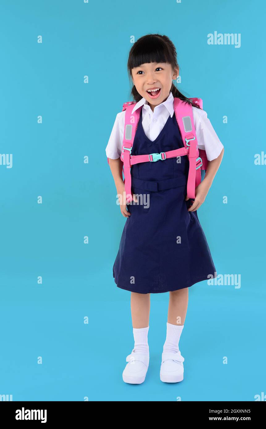 Back To School Portrait Of Happy Asian Cute Little Child Girl In Uniform With School Bag Smiling When Go Back To School Isolated Blue Background Stock Photo Alamy