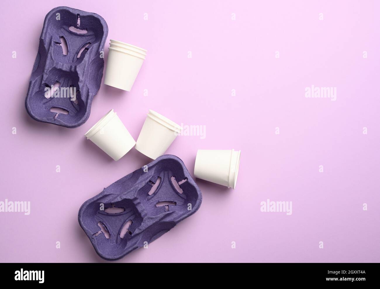 purple recycled paper cup holders and white paper cups, top view, zero