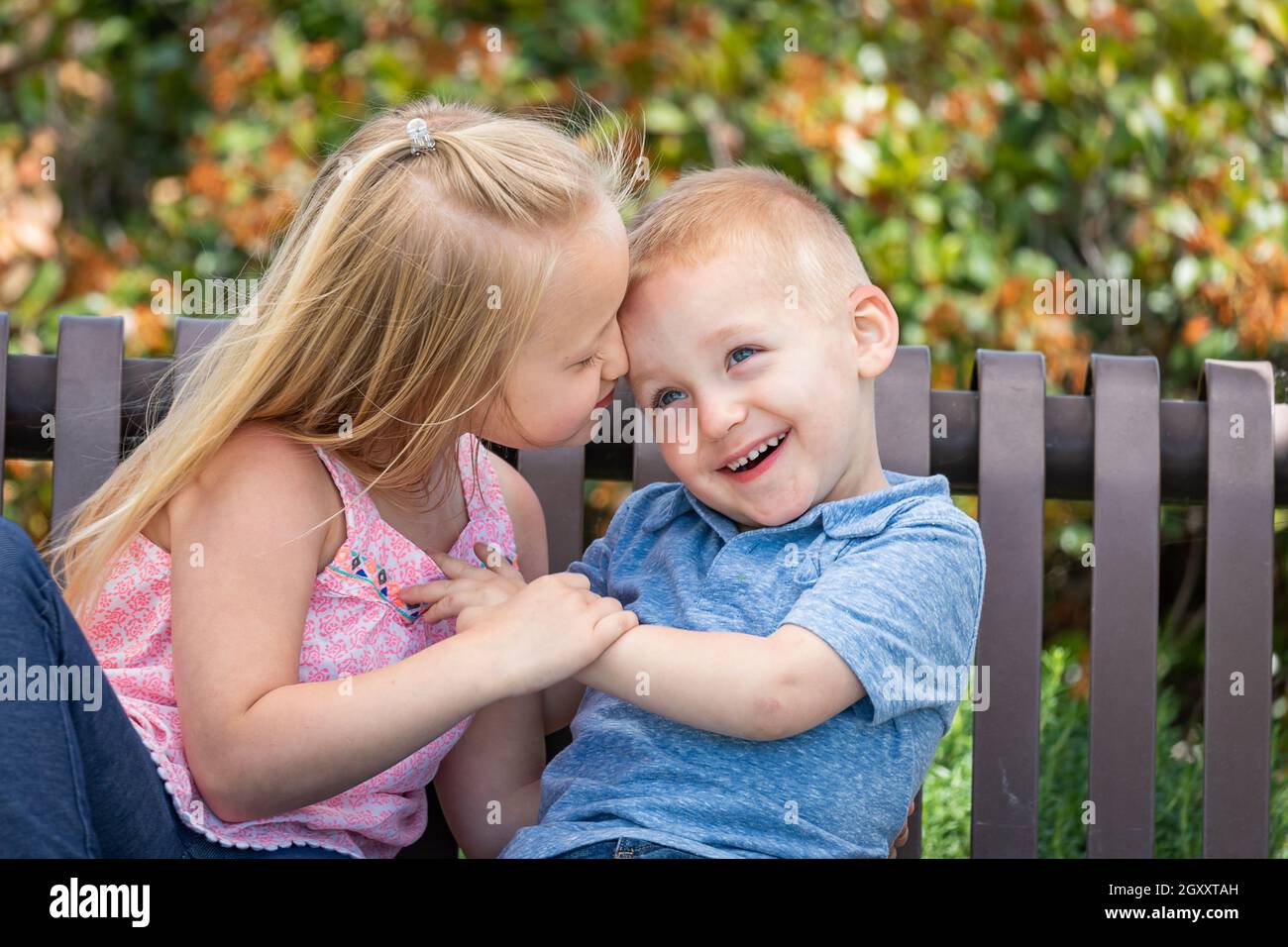 Little boy kissing girl park hi-res stock photography and images - Alamy