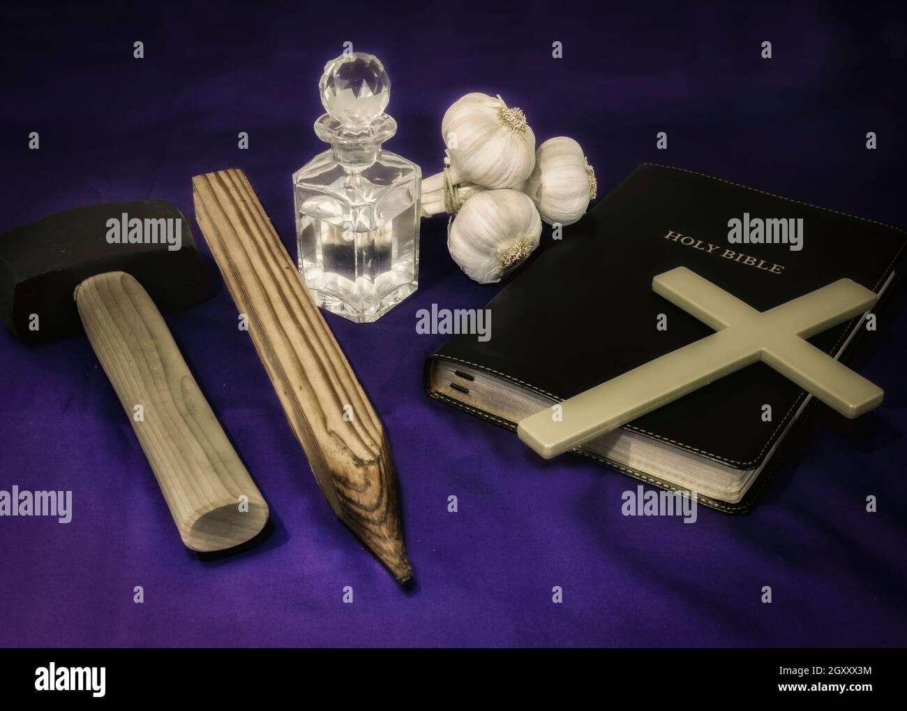 Vampire Hunter starter kit including, Bible, hammer, stake, garlic and holy water Stock Photo