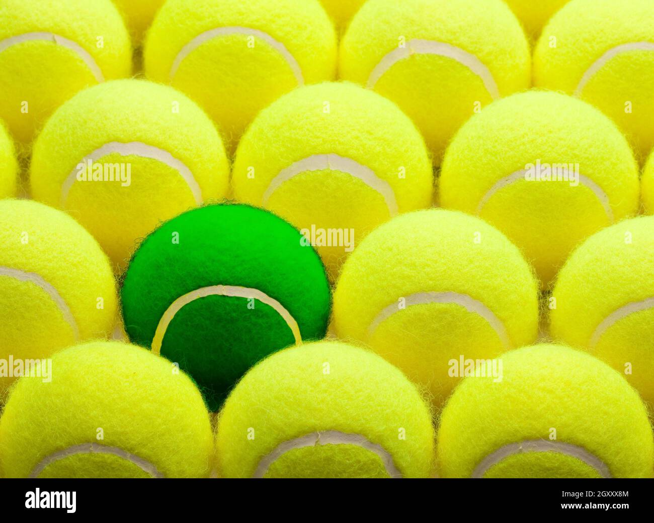 Group of Yellow Tennis Balls and One Green One Stock Photo Alamy