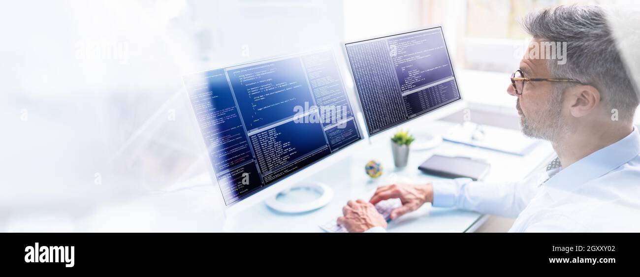Programmer In Office Working On Multiple Computer Monitor Screens Stock ...