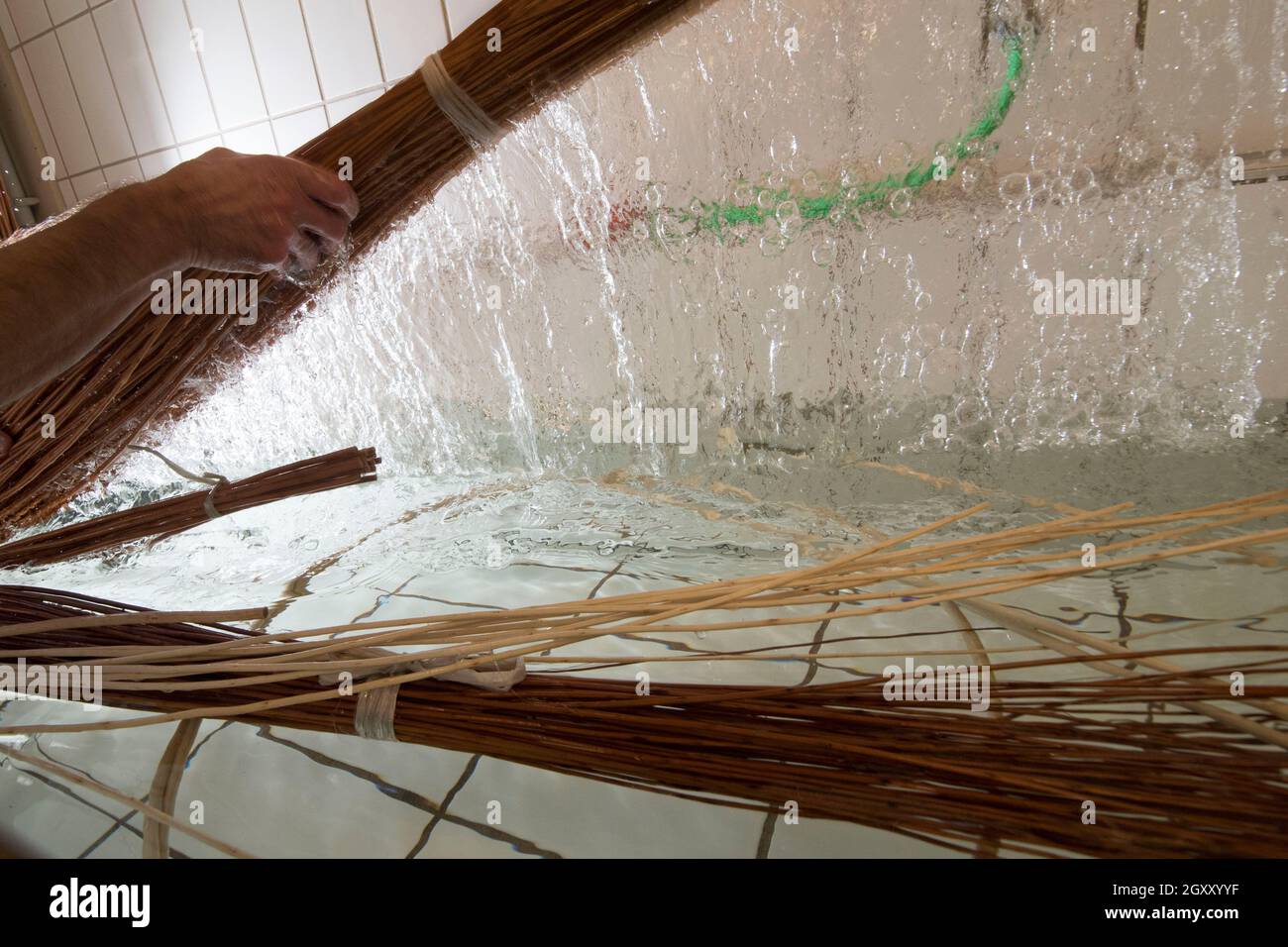 basket weaving in a sheltered workshop, work with disabled or handicapped people Stock Photo
