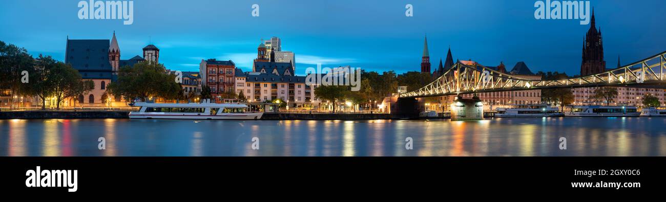 Iron Bridge Eiserner Steg with a view of the Night Panorama of Frankfurt am Main Stock Photo